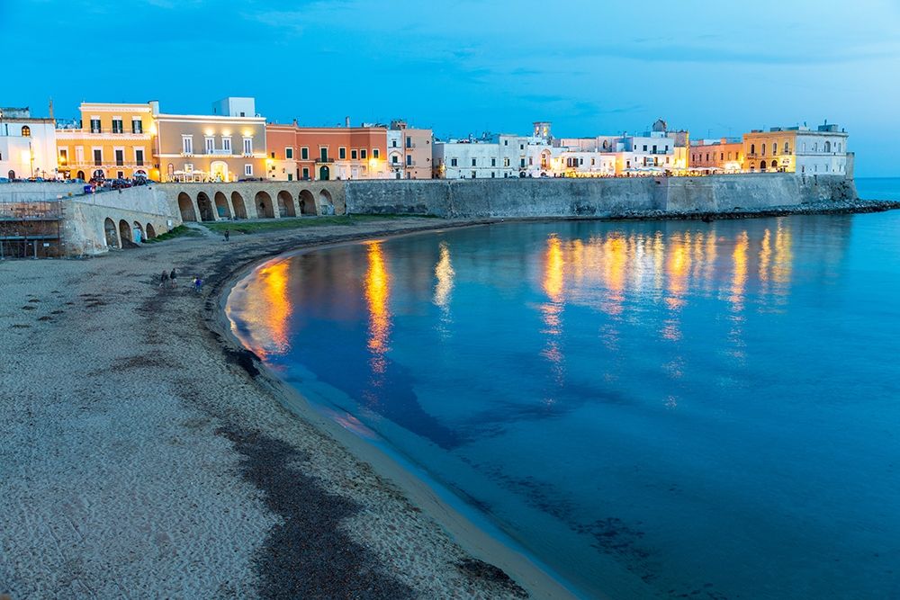 Italy-Apulia-Province of Lecce-Gallipoli Beach and old town section over the Ionian Sea at dusk art print by Emily Wilson for $57.95 CAD