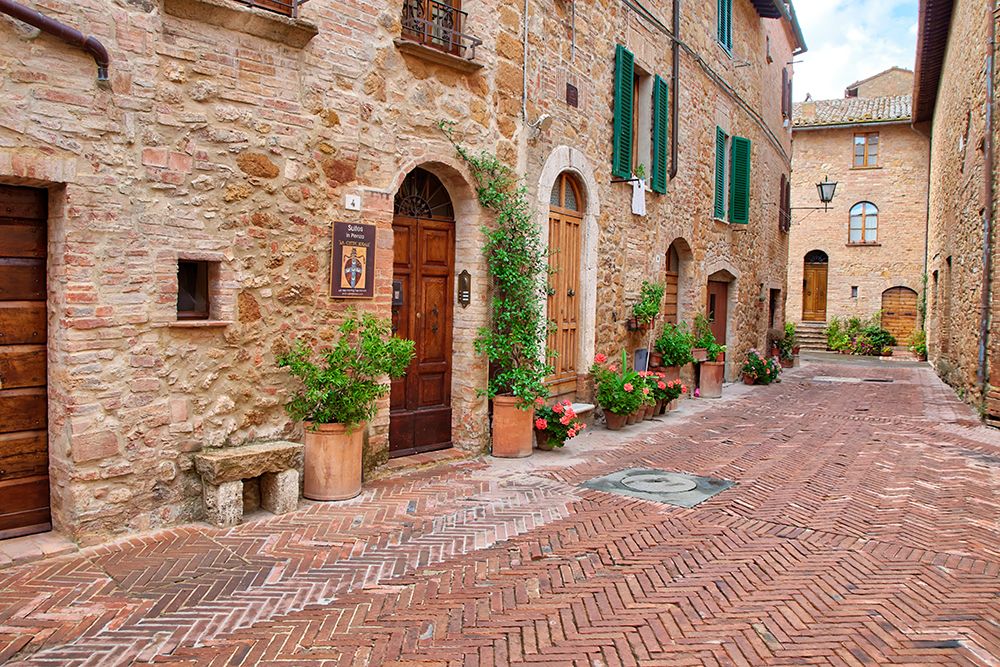 Italy-Tuscany-Pienza Flower pots and potted plants decorate a narrow street in a Tuscany village art print by Julie Eggers for $57.95 CAD