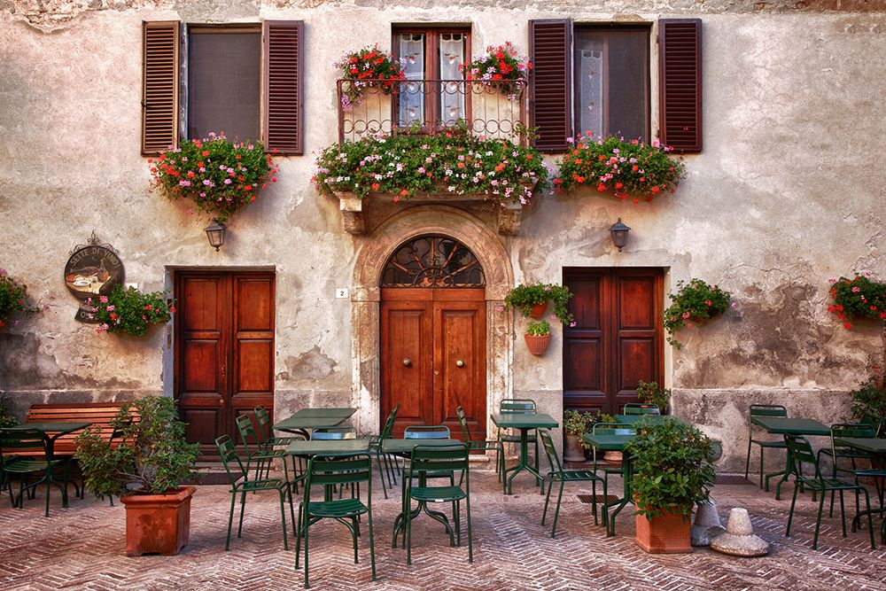 Italy-Tuscany-Pienza Tables and chairs set up outside for outdoor dining in the town of Pienza art print by Julie Eggers for $57.95 CAD