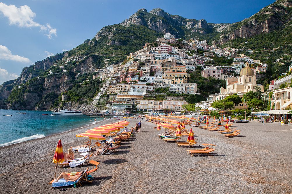 Italy-Positano Beautiful Beach of the Town of Positano with sunbathers art print by Julie Eggers for $57.95 CAD