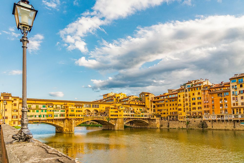 Ponte Vecchio, Florence, Italy. Sunset of famous Ponte Vecchio, bridge dating back to 966AD. art print by Murray McCallum for $57.95 CAD