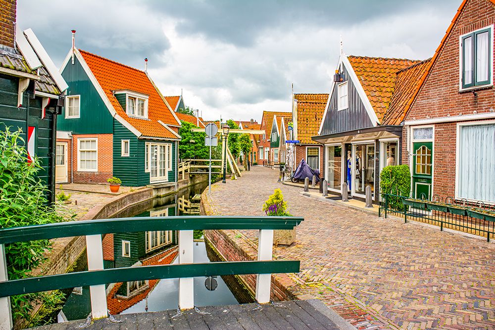Volendam, Netherlands. historic, traditional fishing village on the shores of the North Sea. art print by Murray McCallum for $57.95 CAD