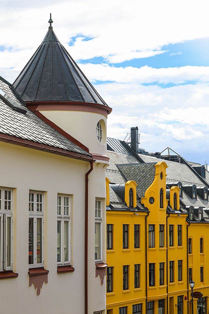 Alesund, Norway. Art deco architecture, colorful yellow narrow buildings with scalloped roofs art print by Jolly Sienda for $57.95 CAD
