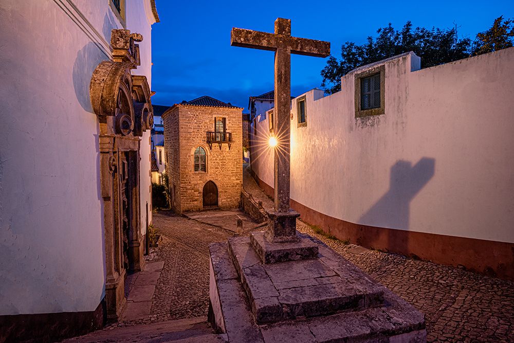 Europe-Portugal-Obidos-Church and cross on cobblestone street at sunset art print by Jaynes Gallery for $57.95 CAD