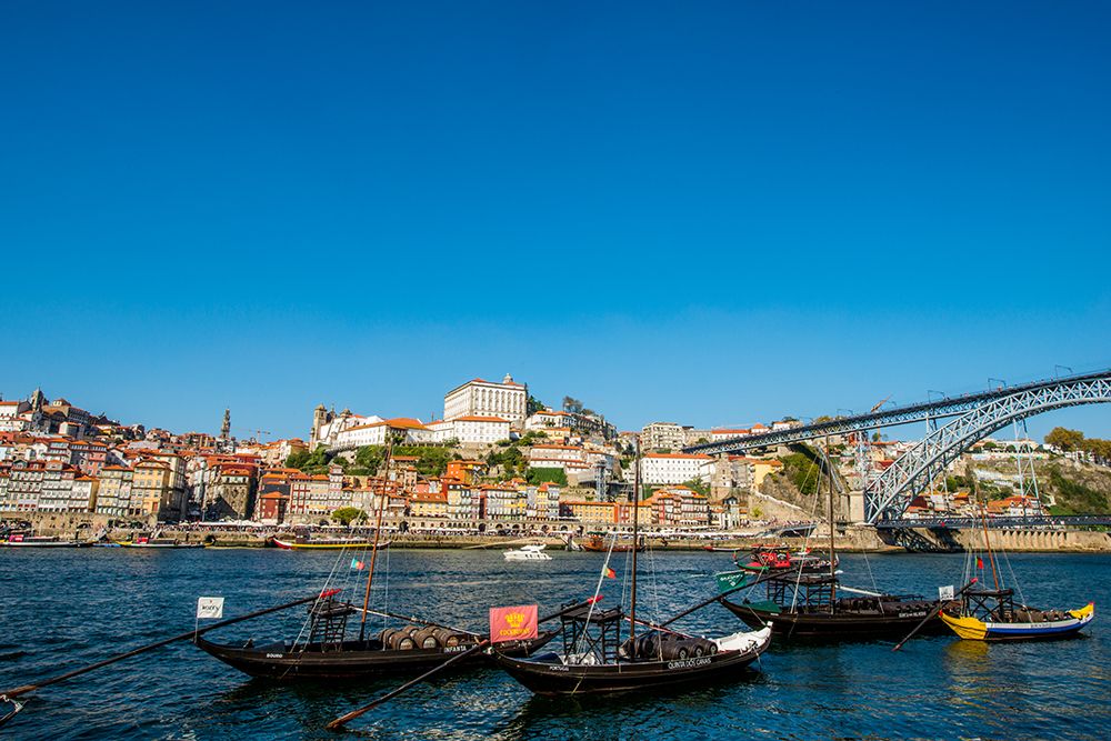 Rabelo boats near the Luis I Bridge over the Douro River, Porto, Portugal. art print by Michael DeFreitas for $57.95 CAD