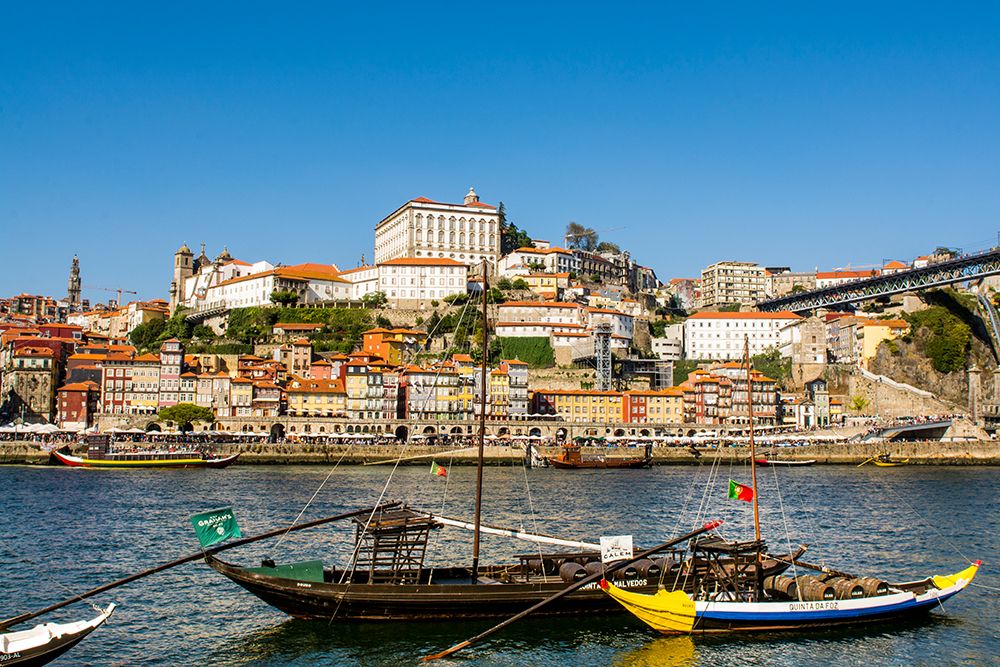 Rabelo boats near the Luis I Bridge over the Douro River, Porto, Portugal. art print by Michael DeFreitas for $57.95 CAD