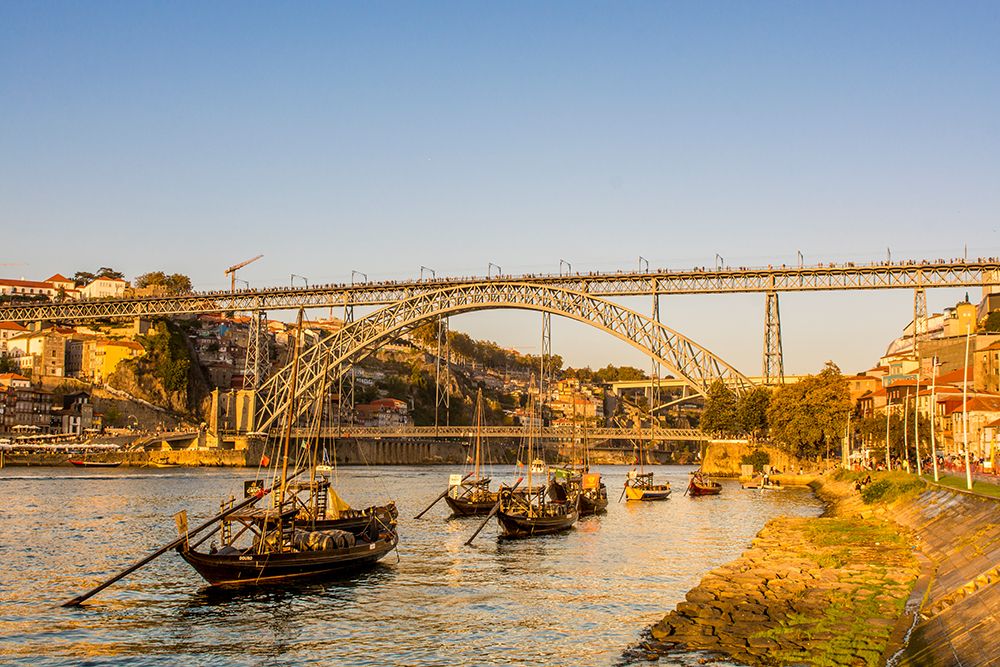 Rabelo boats near the Luis I Bridge over the Douro River, Porto, Portugal. art print by Michael DeFreitas for $57.95 CAD
