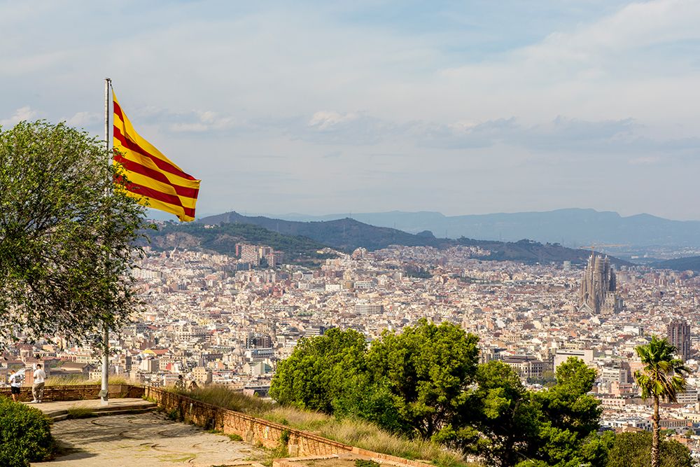 Catalan flag over the Montjuic Castle old fortress, Montjuic Mountain overlooking Barcelona, Spain. art print by Michael DeFreitas for $57.95 CAD