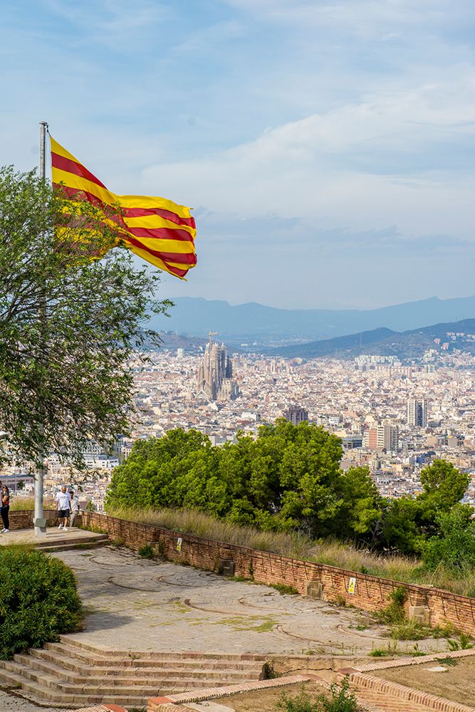 Catalan flag over the Montjuic Castle old fortress, Montjuic Mountain overlooking Barcelona, Spain. art print by Michael DeFreitas for $57.95 CAD