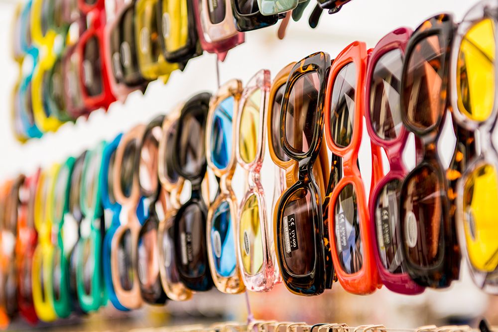 Sunglasses at El Rastro outdoor Sunday flea market in Plaza de Cascorro, Madrid, Spain. art print by Michael DeFreitas for $57.95 CAD