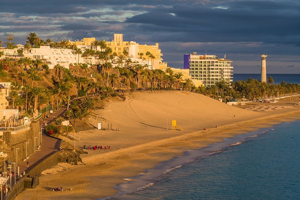 Canary Islands-Fuerteventura Island-Morro Jable-high angle view of Playa de la Cebada beach-sunset art print by Walter Bibikow for $57.95 CAD