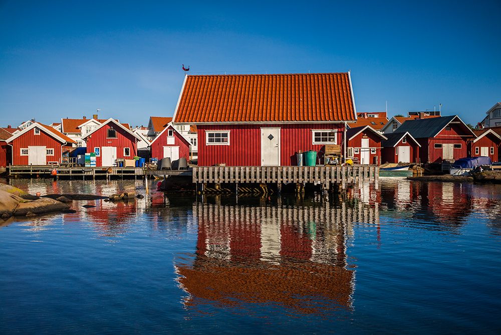 Sweden-Bohuslan-Kungshamn-red fishing shacks in the Fisketangen-old fishermans neighborhood art print by Walter Bibikow for $57.95 CAD