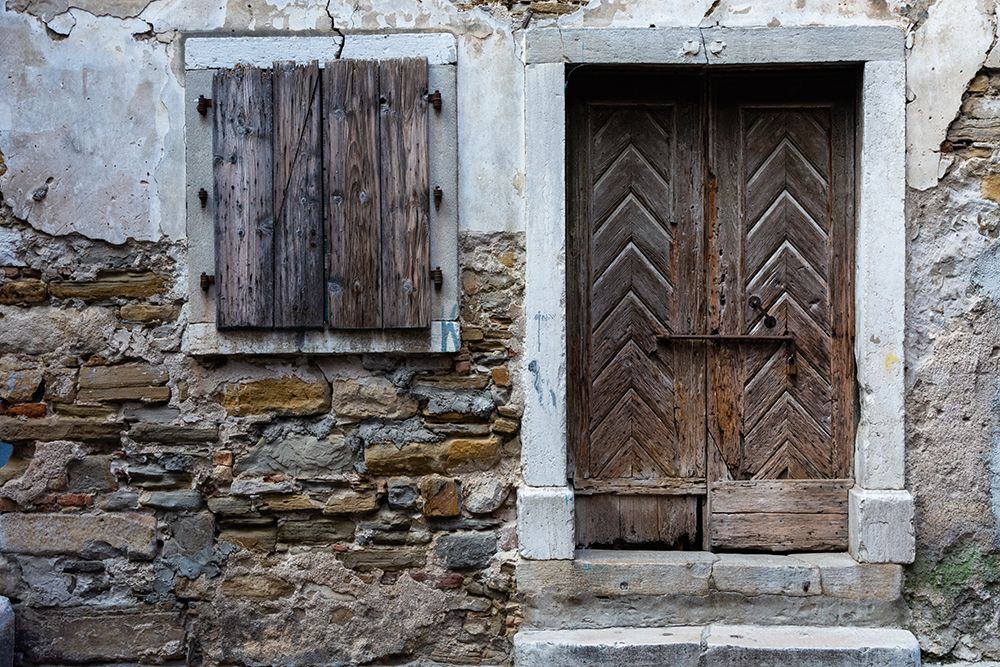 A view of a wooden door and shuttered window Isola-Slovenia art print by Sergio Pitamitz for $57.95 CAD