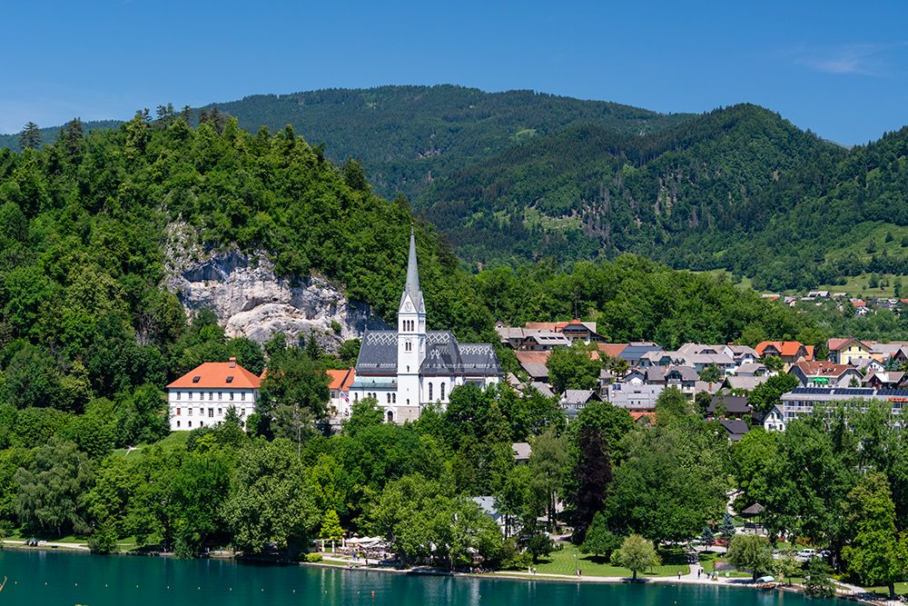 A view of the town of Bled and Saint Martins church Bled-Slovenia art print by Sergio Pitamitz for $57.95 CAD