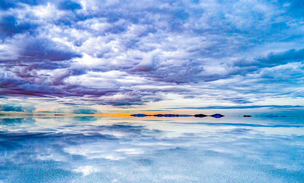 Salar de Uyuni, Bolivia. Clouds hanging over the Salar de Uyuni, the worlds largest salt flat. art print by Murray McCallum for $57.95 CAD