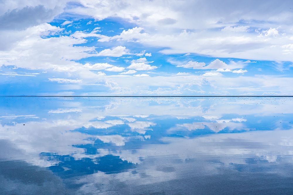 Salar de Uyuni, Bolivia. Clouds reflecting over the Salar de Uyuni, the worlds largest salt flat. art print by Murray McCallum for $57.95 CAD