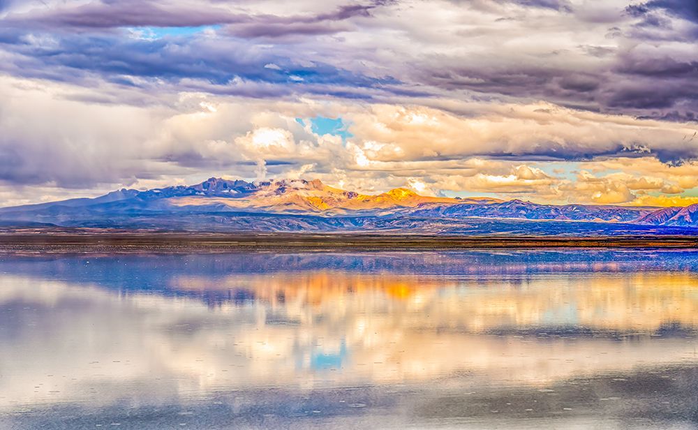 Salar de Uyuni, Bolivia. Storm clouds reflected over the Salar de Uyuni, with the Andes Mountains art print by Murray McCallum for $57.95 CAD