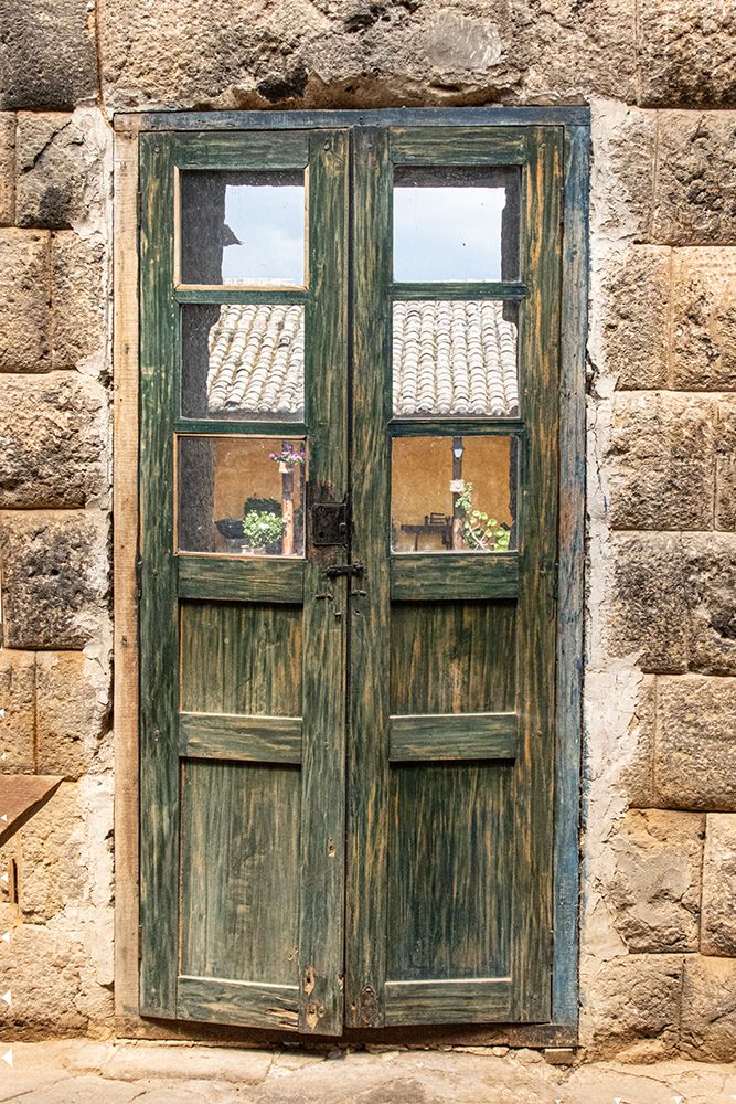 Old wooden door with worn out green paint between walls built by the Inca in the 1440s in Ecuador. art print by Mallorie Ostrowitz for $57.95 CAD