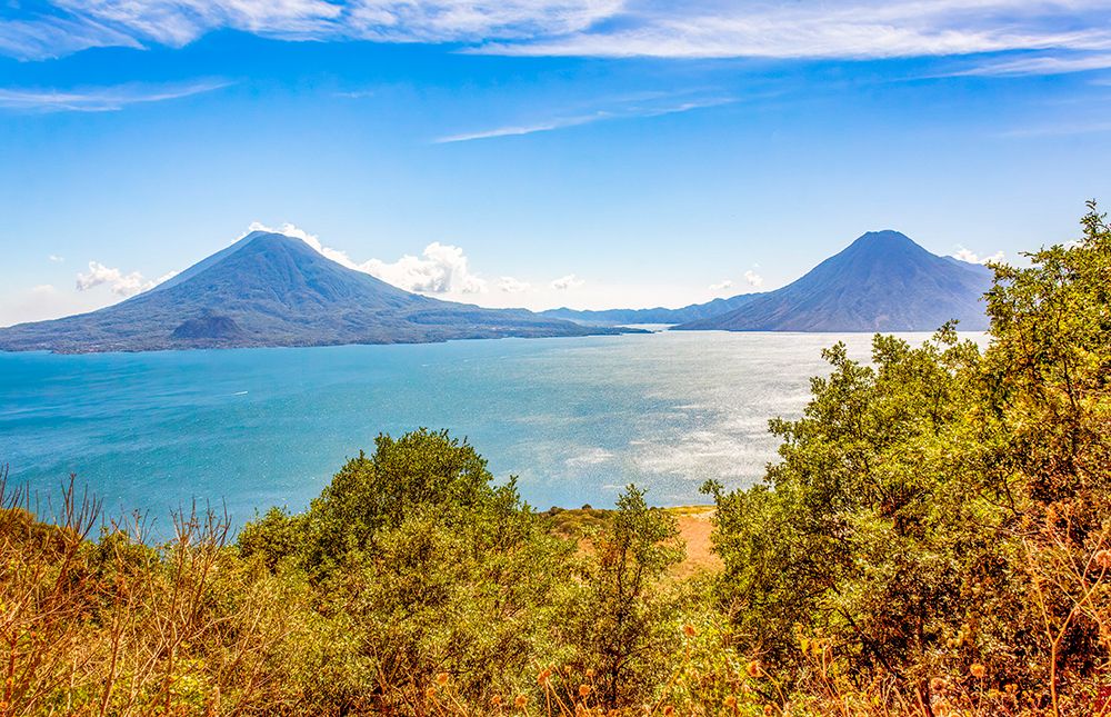 Solola Department, Guatemala. Lake Atitlan surrounded by volcanoes, Atitlan, Toliman and San Pedro. art print by Murray McCallum for $57.95 CAD