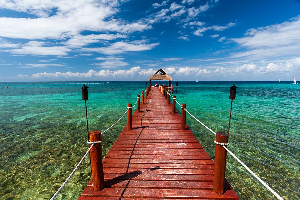 A pier and a palapa on a beach on Cozumel Island-Quintana Roo-Mexico art print by Sergio Pitamitz for $57.95 CAD