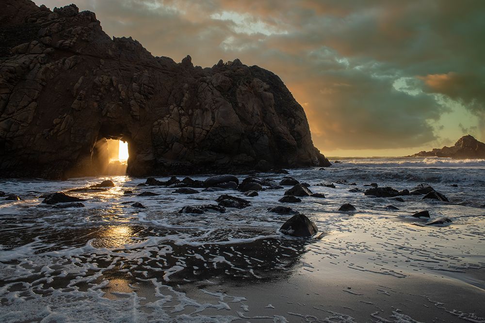 Sunset shines through a tunnel in this sea rock at Big Sur. art print by Betty Sederquist for $57.95 CAD