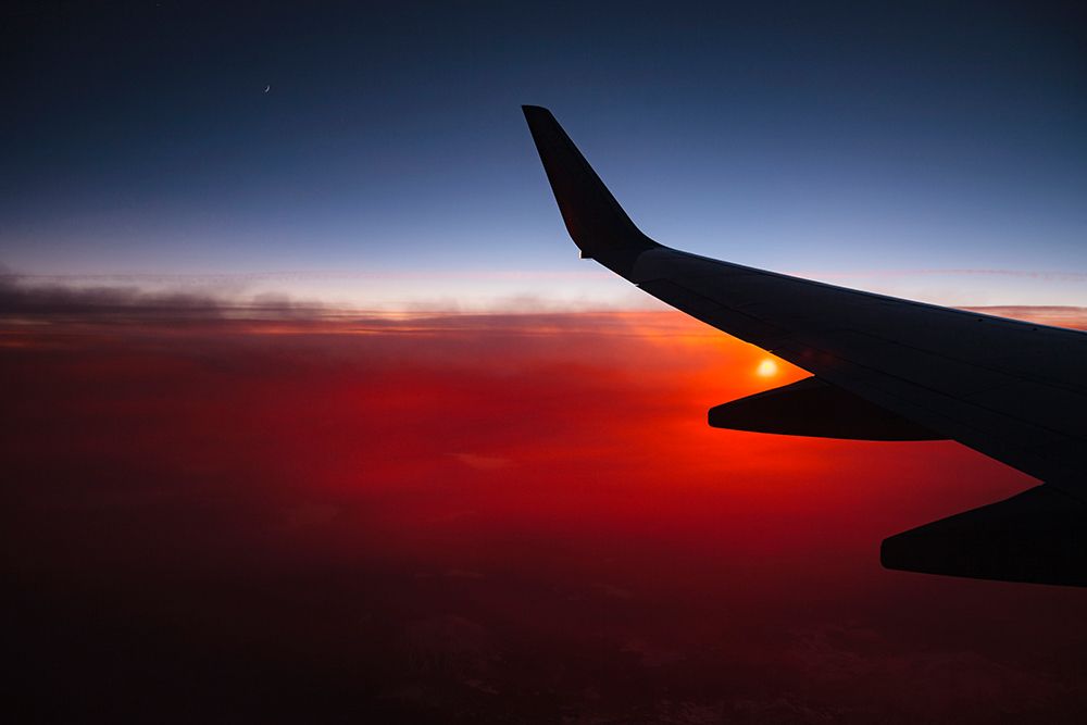 Aerial sunset view from airplane window above California, USA art print by Rob Casey for $57.95 CAD