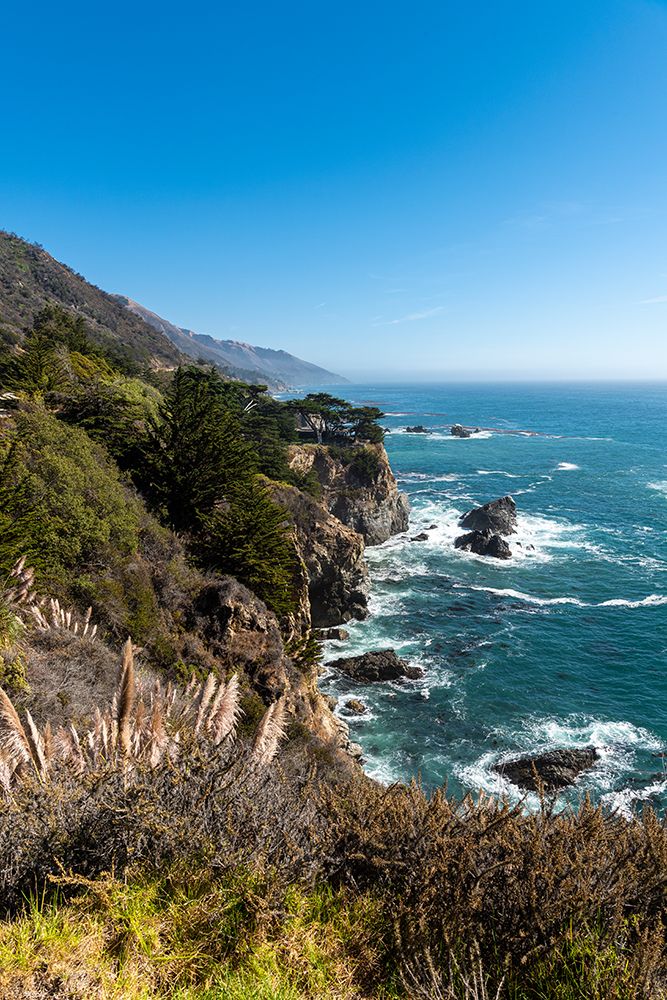 The rugged coastline of Big Sur with wisps of fog drifting into the hills art print by Sheila Haddad for $57.95 CAD