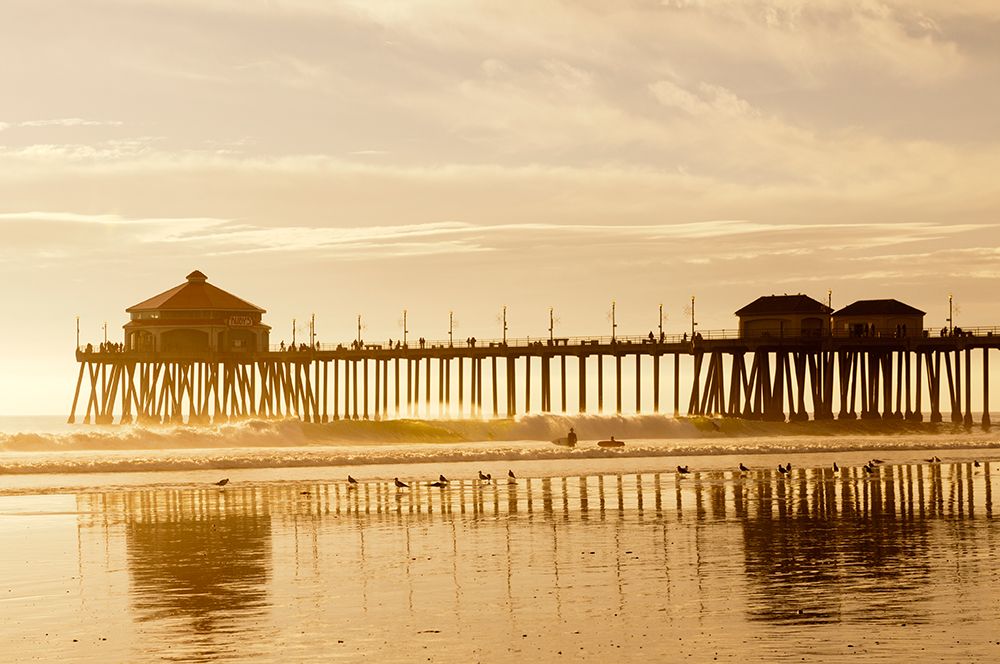 The Huntington Beach Pier and surfers at sunset Huntington Beach-California art print by Sergio Pitamitz for $57.95 CAD