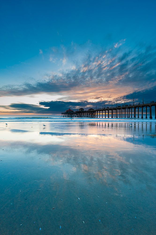 The Huntington Beach Pier and reflections on the wet beach at sunset Huntington Beach-California art print by Sergio Pitamitz for $57.95 CAD