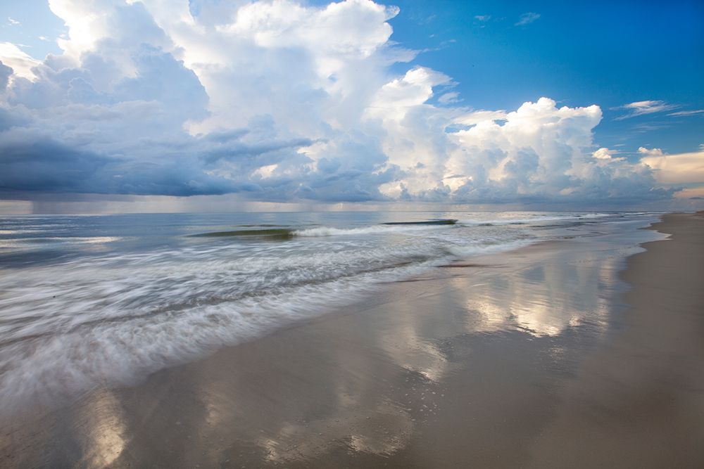 USA- Georgia- Tybee Island. Sunrise with clouds and reflections along the coast. art print by Joanne Wells for $57.95 CAD