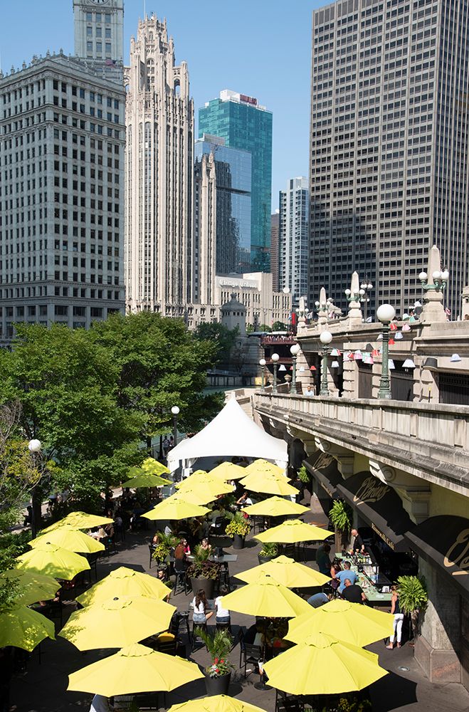 Yellow umbrellas at cafe at Riverwalk along the Chicago River in downtown Chicago art print by Alan Klehr for $57.95 CAD