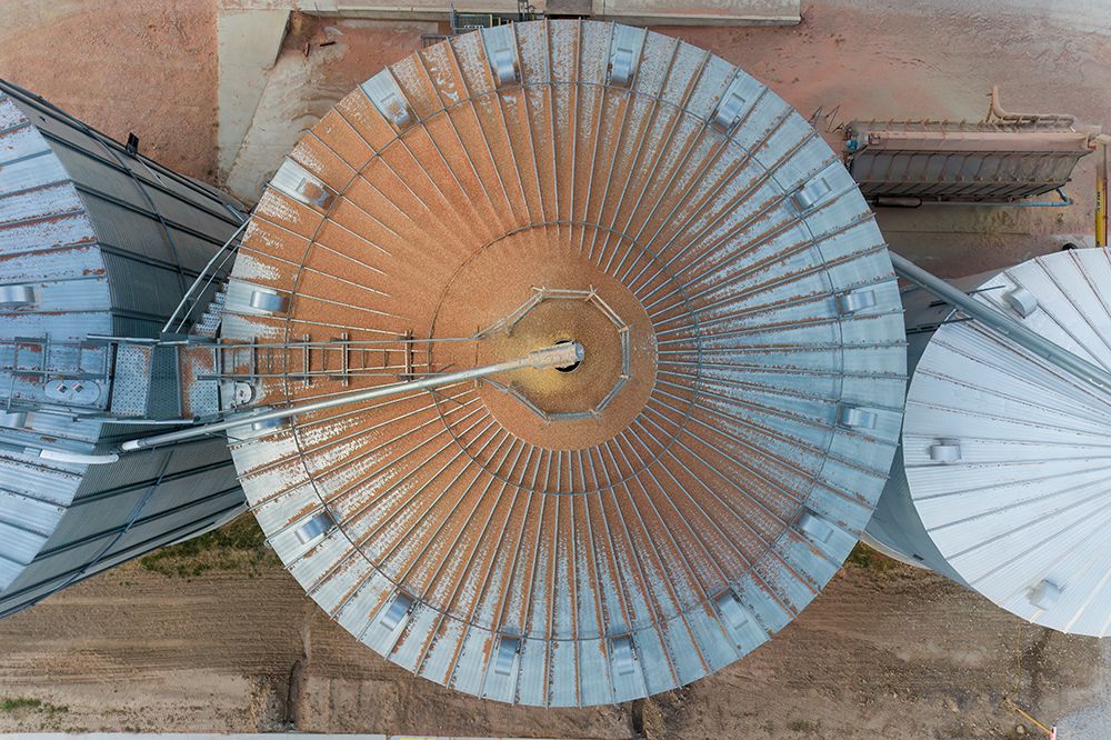 Aerial view of a grain bin with corn dust, Marion County, Illinois. art print by Richard and Susan Day for $57.95 CAD