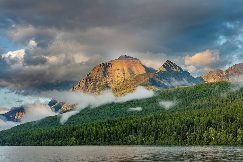 Stormy late afternoon light on Rainbow Peak at Bowman Lake in Glacier National Park-Montana-USA art print by Chuck Haney for $57.95 CAD