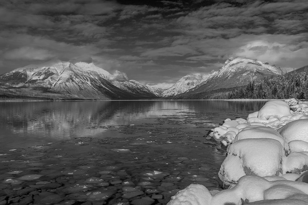 Mountains reflect in wintry Lake McDonald in Glacier National Park-Montana-USA art print by Chuck Haney for $57.95 CAD