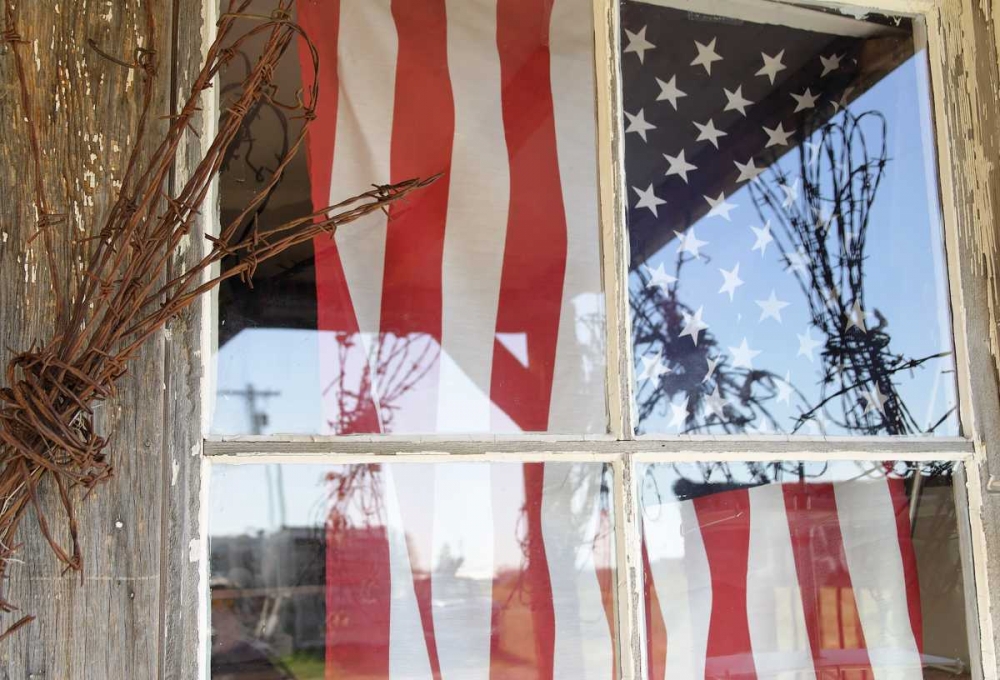 OR, Shaniko Flag in window next to barbed wire art print by Nancy ,  Steve Ross for $57.95 CAD