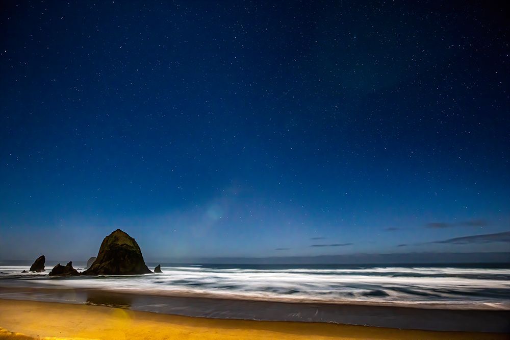 USA- Oregon. Cannon Beach and Haystack Rock stars showing during blue light. art print by Darrell Gulin for $57.95 CAD