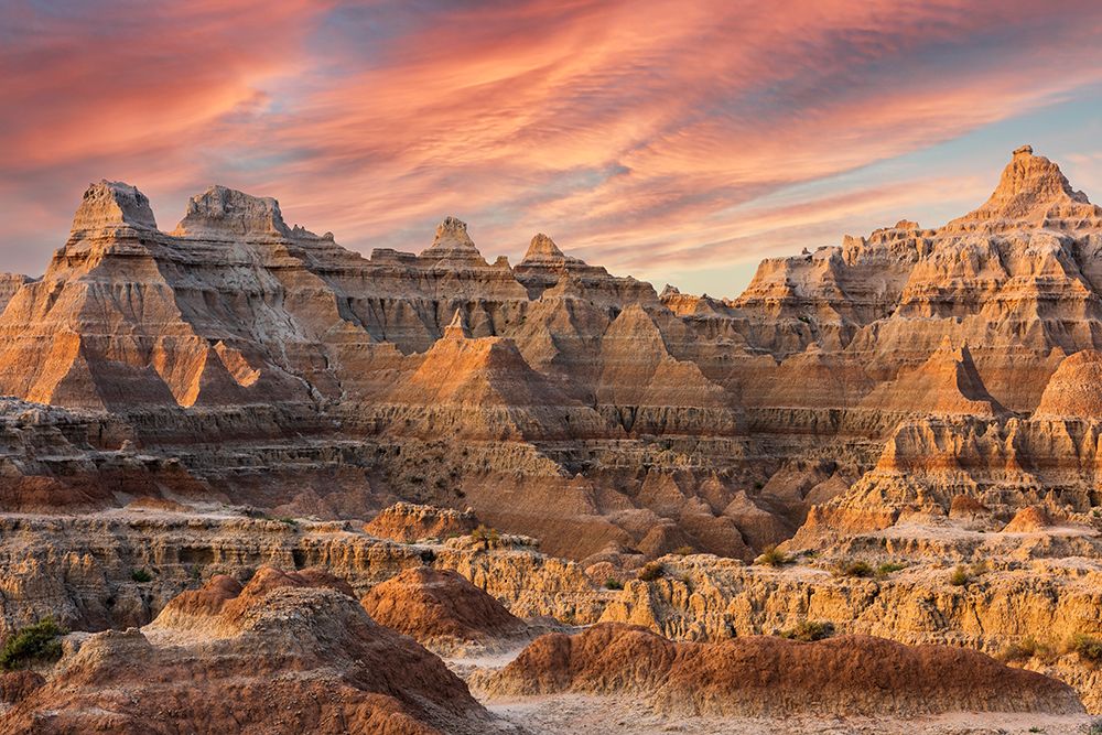Magnificent set of striated hoodoos set against the backdrop of sunset colors in the sky art print by Sheila Haddad for $57.95 CAD