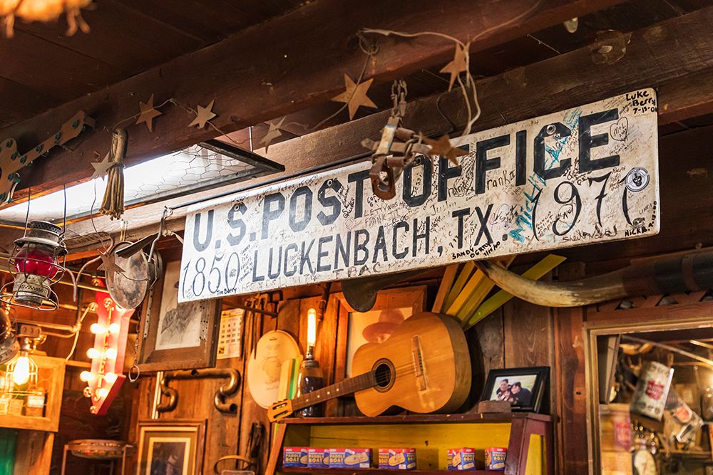 Luckenbach-Texas-USA-Post office sign in a tourist shop in Luckenbach-Texas art print by Emily Wilson for $57.95 CAD