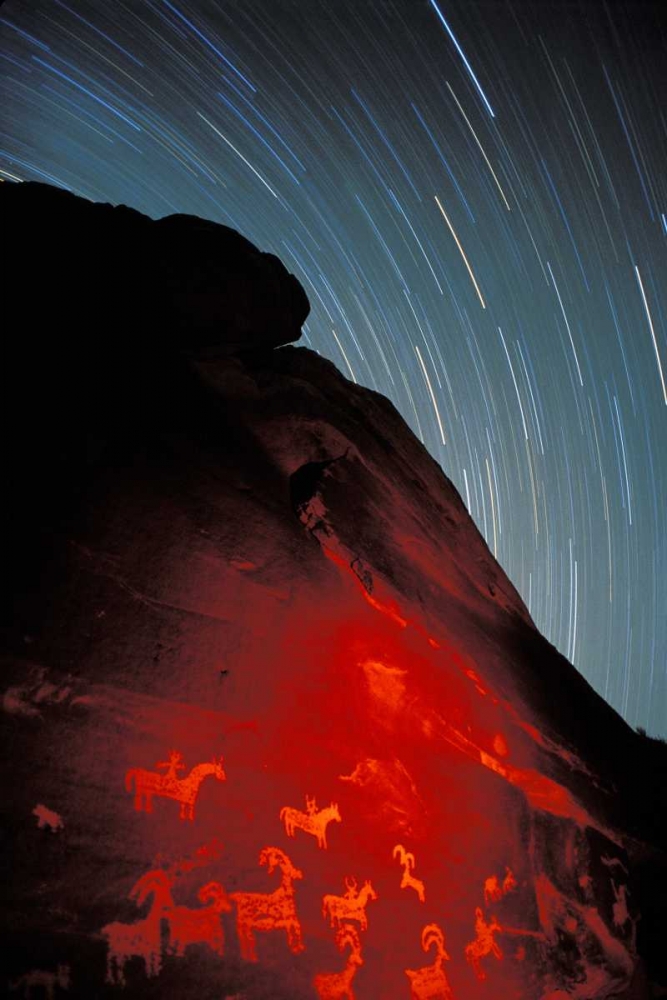 USA, Utah, Arches NP, Petroglyphs and star trails art print by Dennis Kirkland for $57.95 CAD