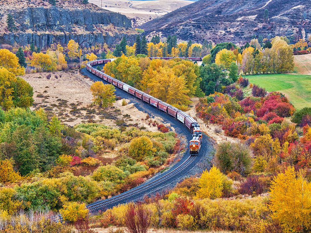 USA-Washington State-Kittitas County. Burlington Northern Santa Fe train along the Yakima River. art print by Julie Eggers for $57.95 CAD