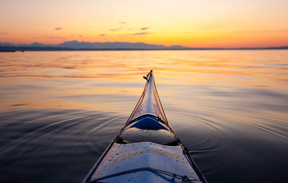 Sea kayak bow view of the Olympic Mountains on Puget Sound, Seattle, Washington State, USA. art print by Rob Casey for $57.95 CAD