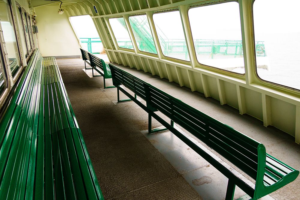 Row of benches and windows, ferry crossing Puget Sound from Edmonds to Kingston, Washington. art print by Rob Casey for $57.95 CAD