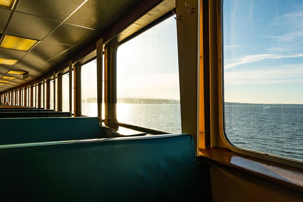 Row of seats and window view of Puget Sound on the Spokane ferry, Seattle, Washington State, USA. art print by Rob Casey for $57.95 CAD
