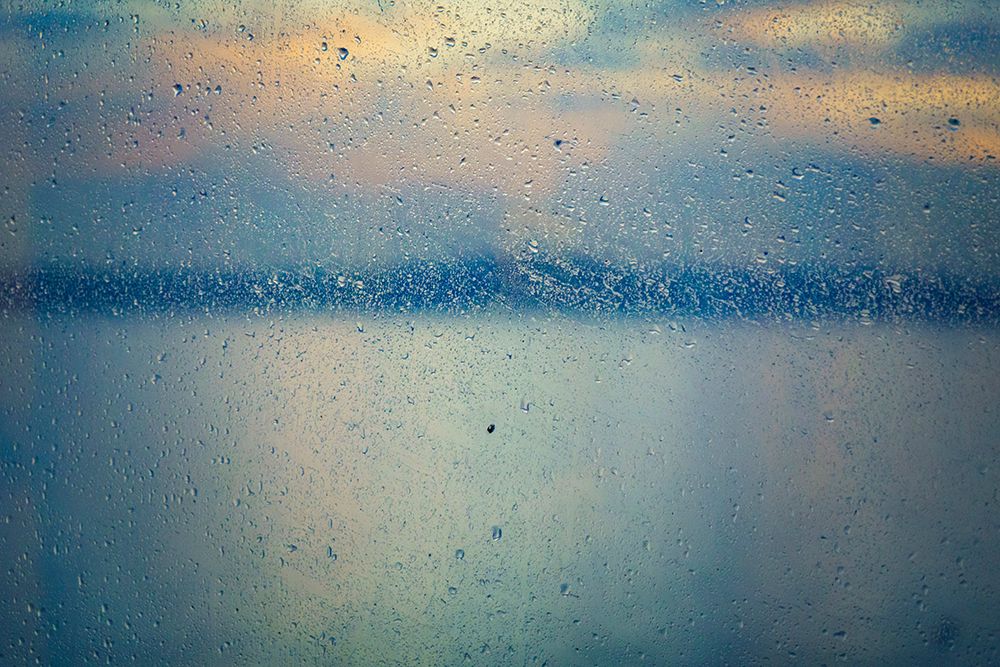 Raindrops on window with water view in background, Puget Sound, Washington State, USA. art print by Rob Casey for $57.95 CAD