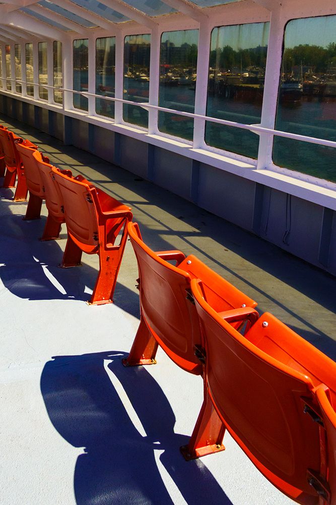 Empty chairs on the Black Ball Ferry, Port Angeles, Washington State, USA. art print by Rob Casey for $57.95 CAD