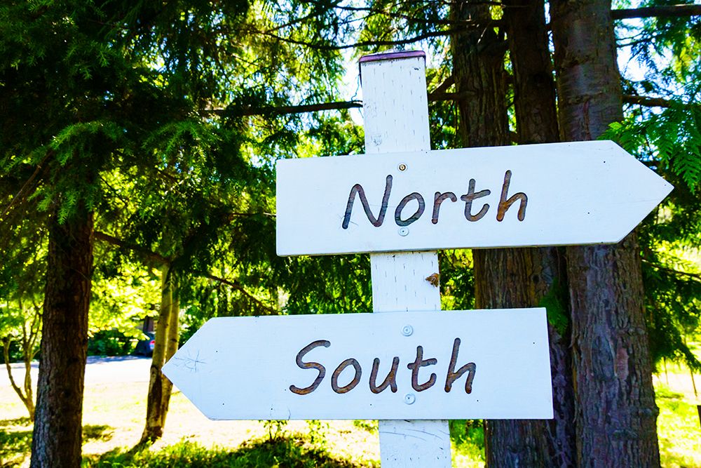 North South sign directions, Lummi Island, Washington State, USA. art print by Rob Casey for $57.95 CAD