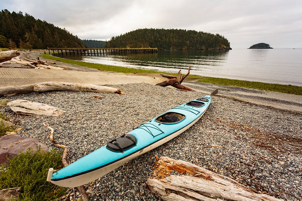 Sea kayak on the shore of Bowman Bay, Deception Pass State Park, Washington State, USA. art print by Rob Casey for $57.95 CAD