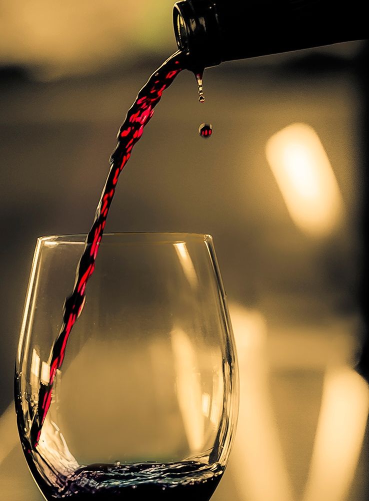 One drop shows as red wine is poured into glass art print by Richard Duval for $57.95 CAD