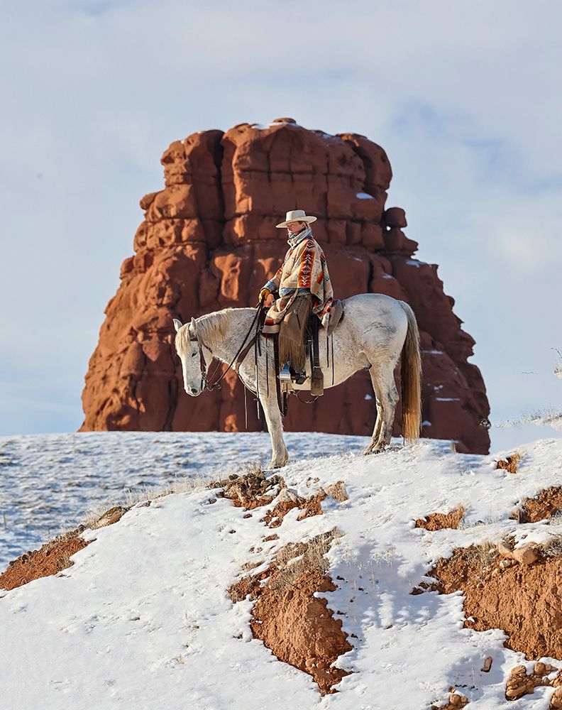 USA- Wyoming. Hideout Ranch cowgirl on horseback riding on ridgeline snow.  art print by Darrell Gulin for $57.95 CAD