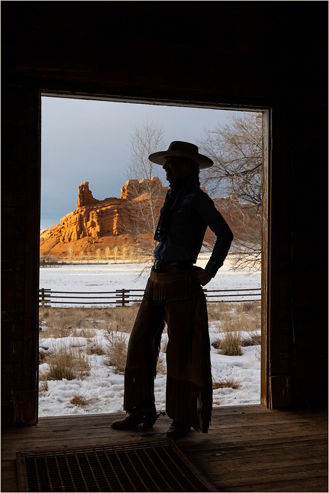 USA- Shell- Wyoming. Hideout Ranch with cowgirl silhouetted in doorway of log cabin.  art print by Darrell Gulin for $57.95 CAD